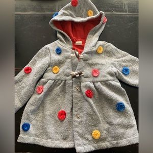 Grey hooded sweater with rainbow colored details